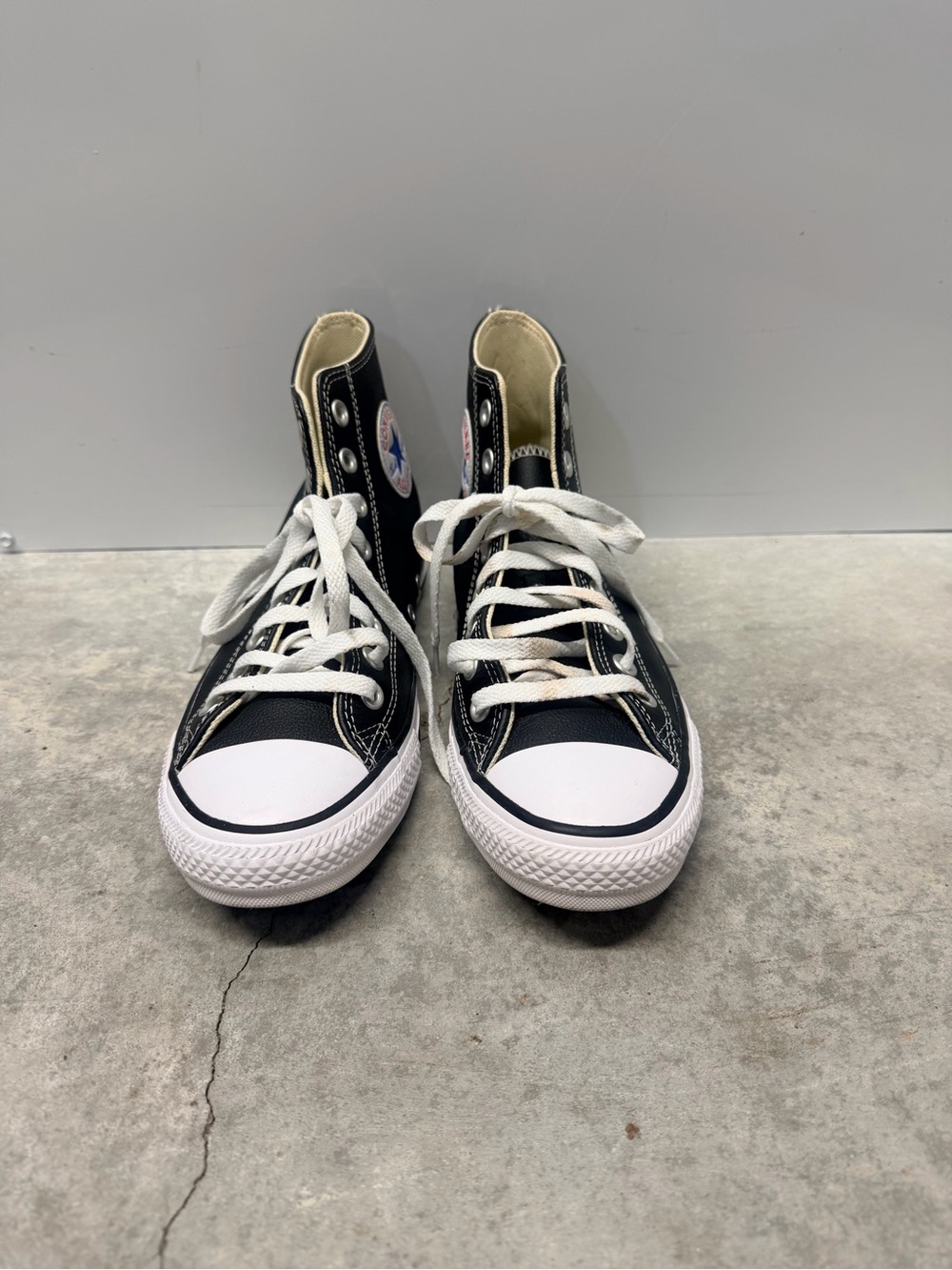 Converse men’s size 6.5  and woman’s size 8.5 Black & White High-Top Sneakers